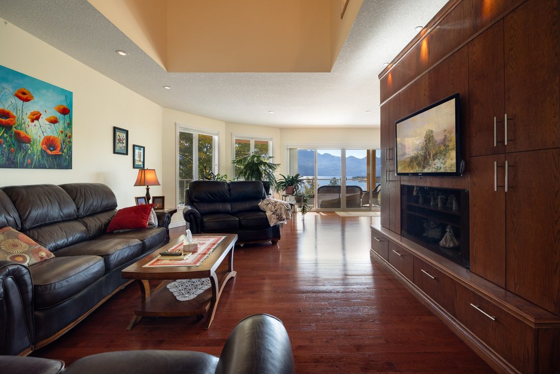 The great room, with hardwood floors and a wall of built-in cabinetry