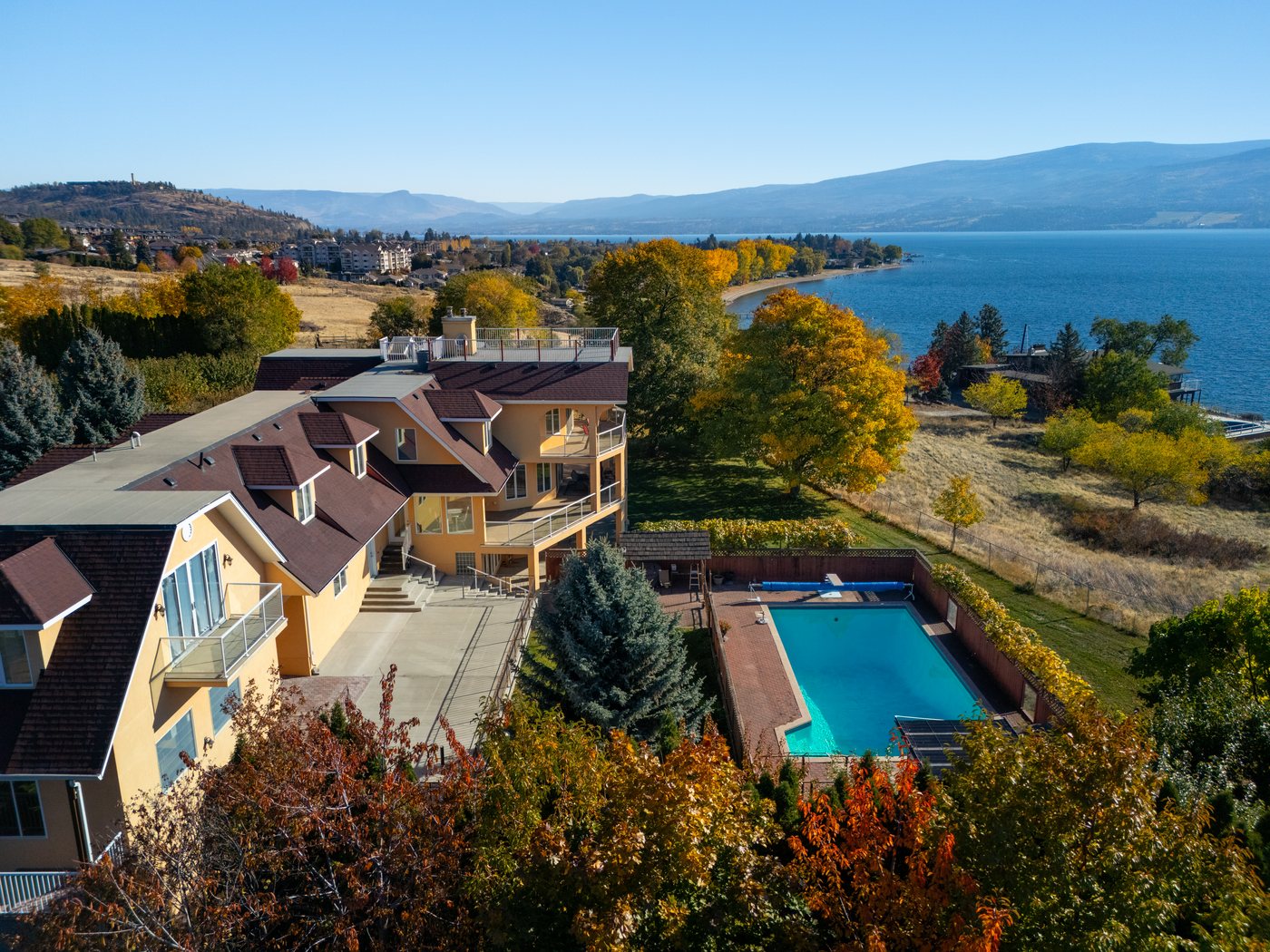Aerial view of 3820 Wetton Road — the main residence, pool and Okanagan Lake